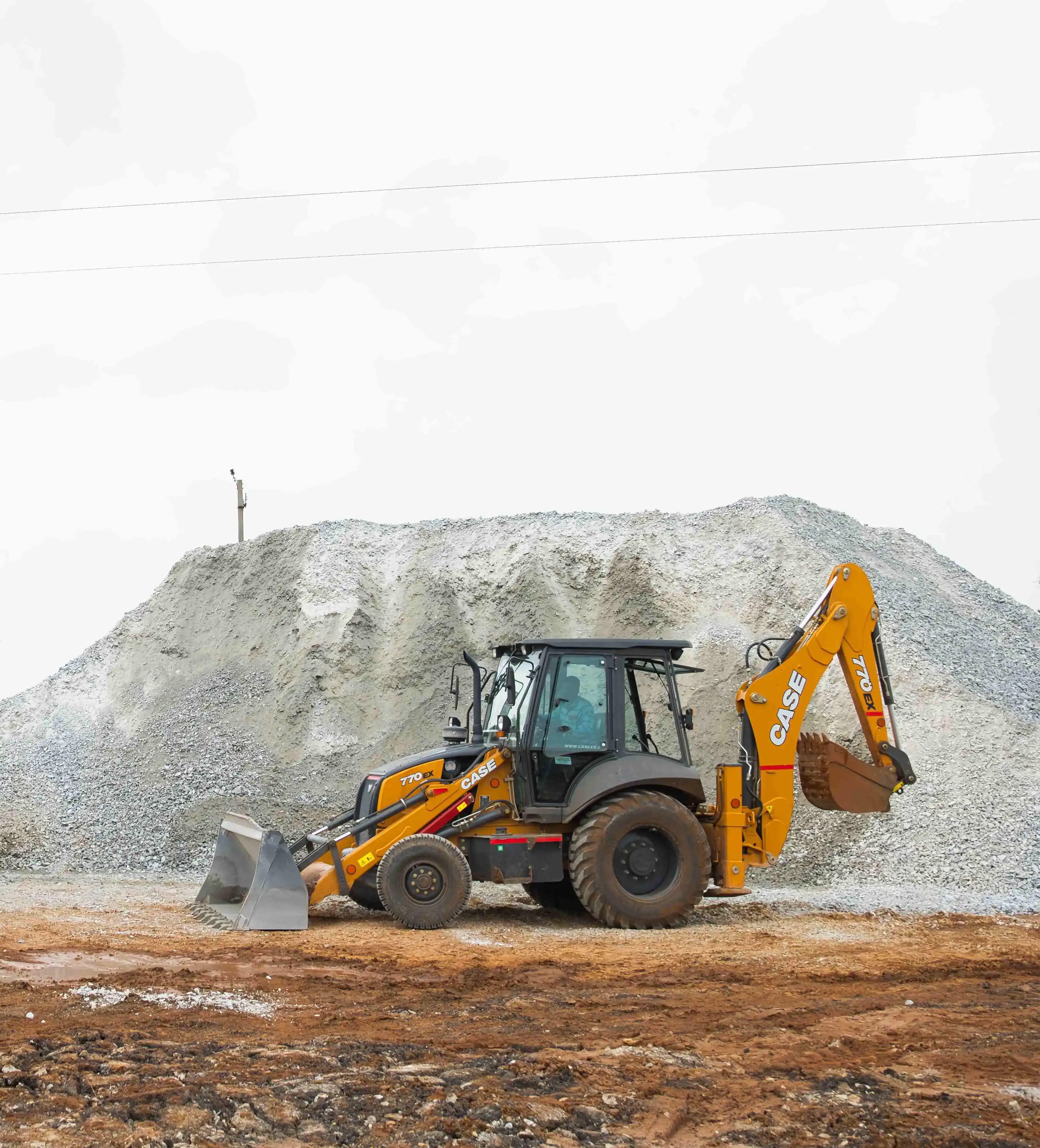 Modern construction equipment and machinery used by National Infrabuild for infrastructure development projects in Karnataka